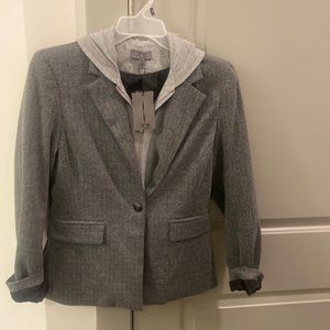Grey blazer with sweatshirt and hoodie attached.